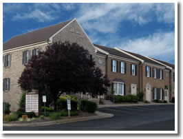 Ours is the dark brick building with the bay window.